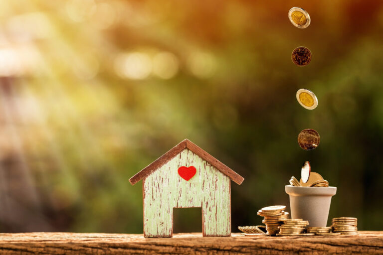Home,Model,With,Red,Heart,And,Stack,And,Dropping,Of